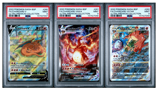 Three Pokémon trading cards in protective cases with PSA labels on a white background
